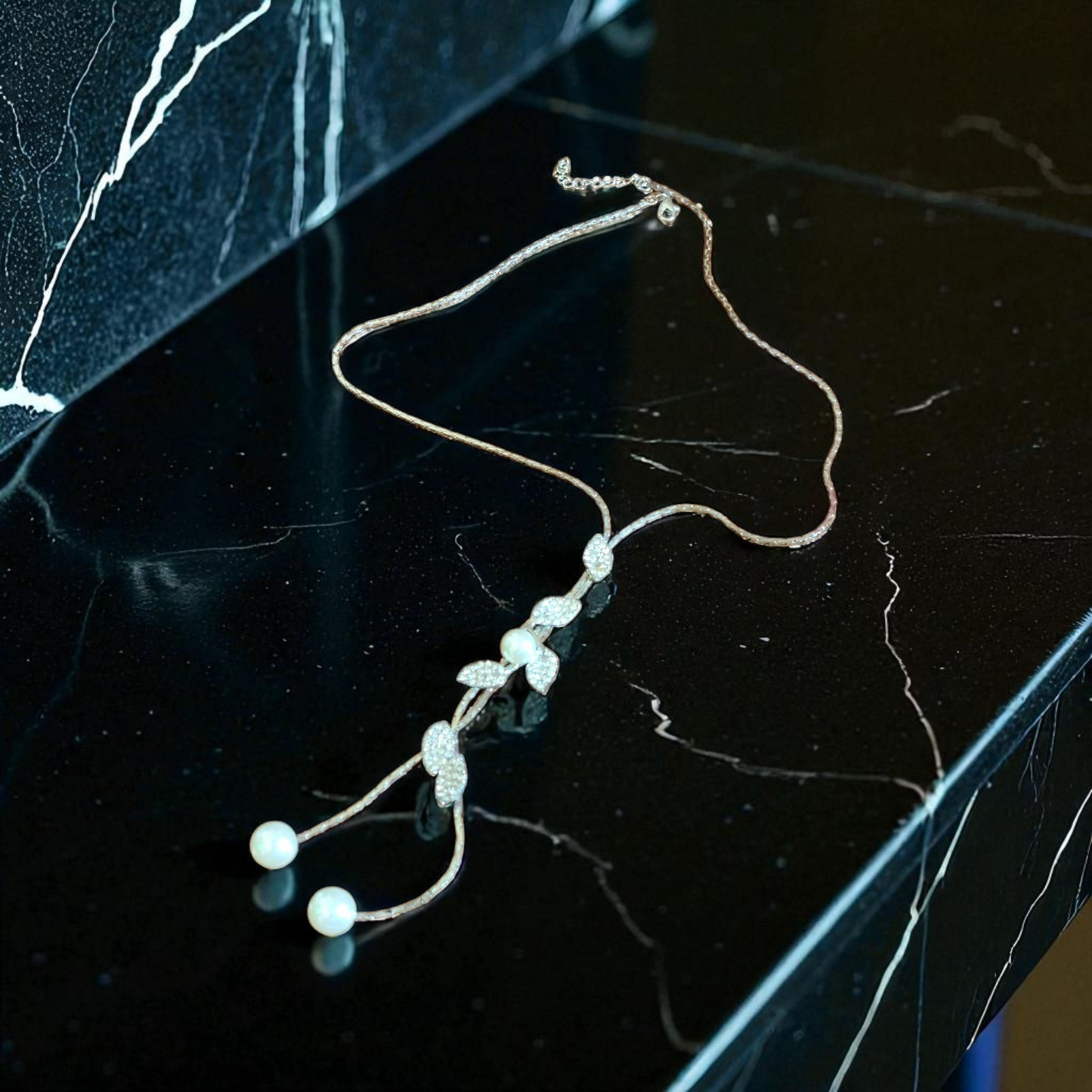 faux pearl and diamond necklace