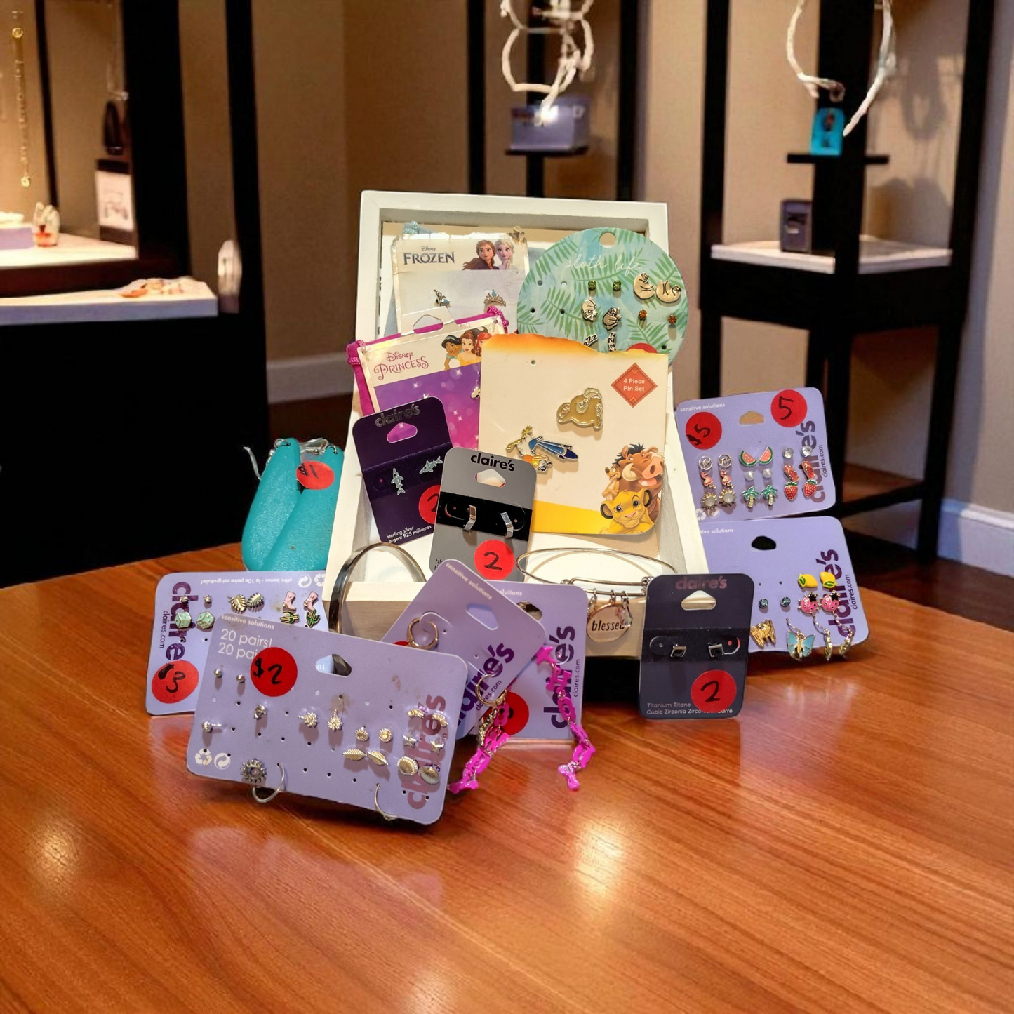 wooden Jewelry box with lot of earrings and 2 bracelets.