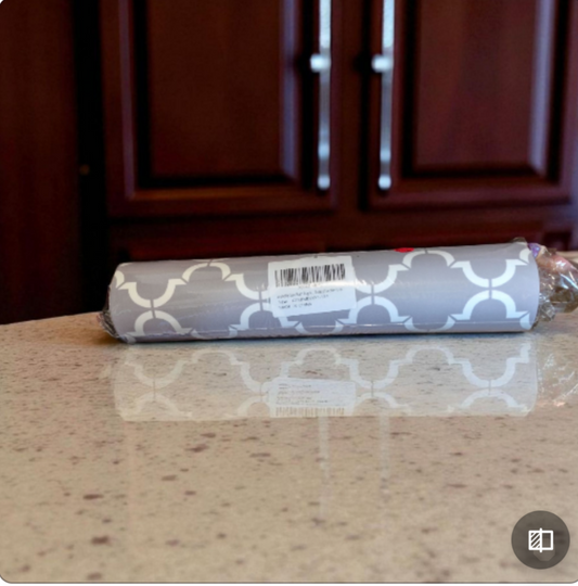 grey and white pattern bath mat