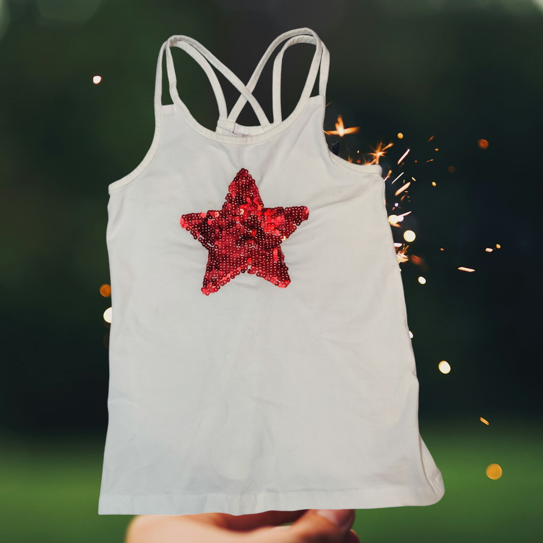 White Thin Strap Kids Tank with sparkle red star on the front
