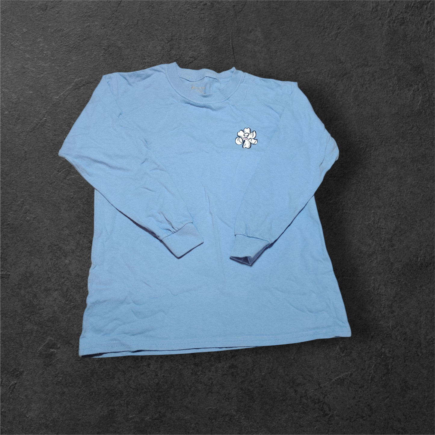 Light blue long sleeve shirt with flower print on chest&nbsp;